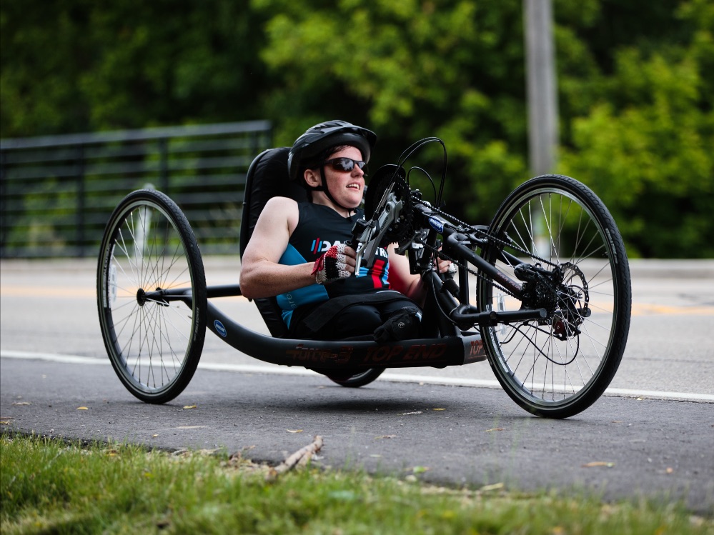 Athlete riding a hand cycle.