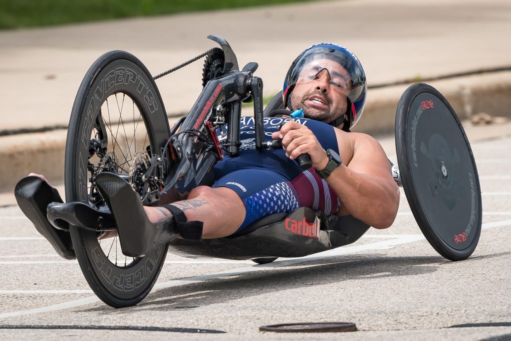 Howie Sanborn riding a racing hand cycle.