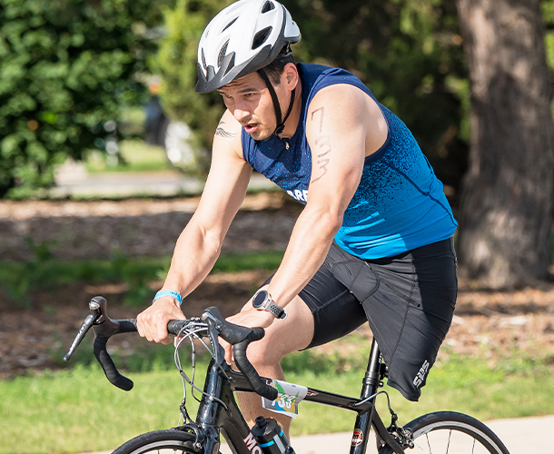 Jorge Torres riding an upright bike.
