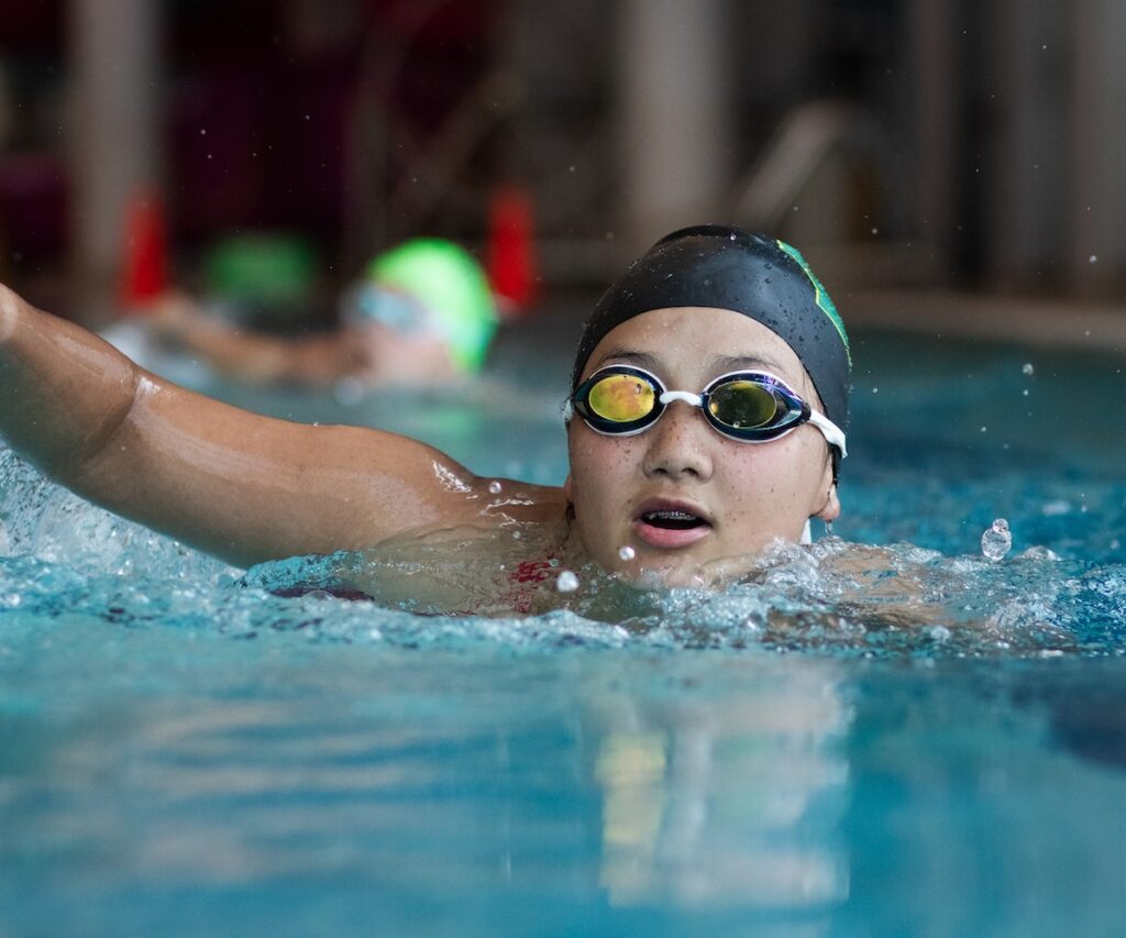 Hannah Longmire swimming indoors.